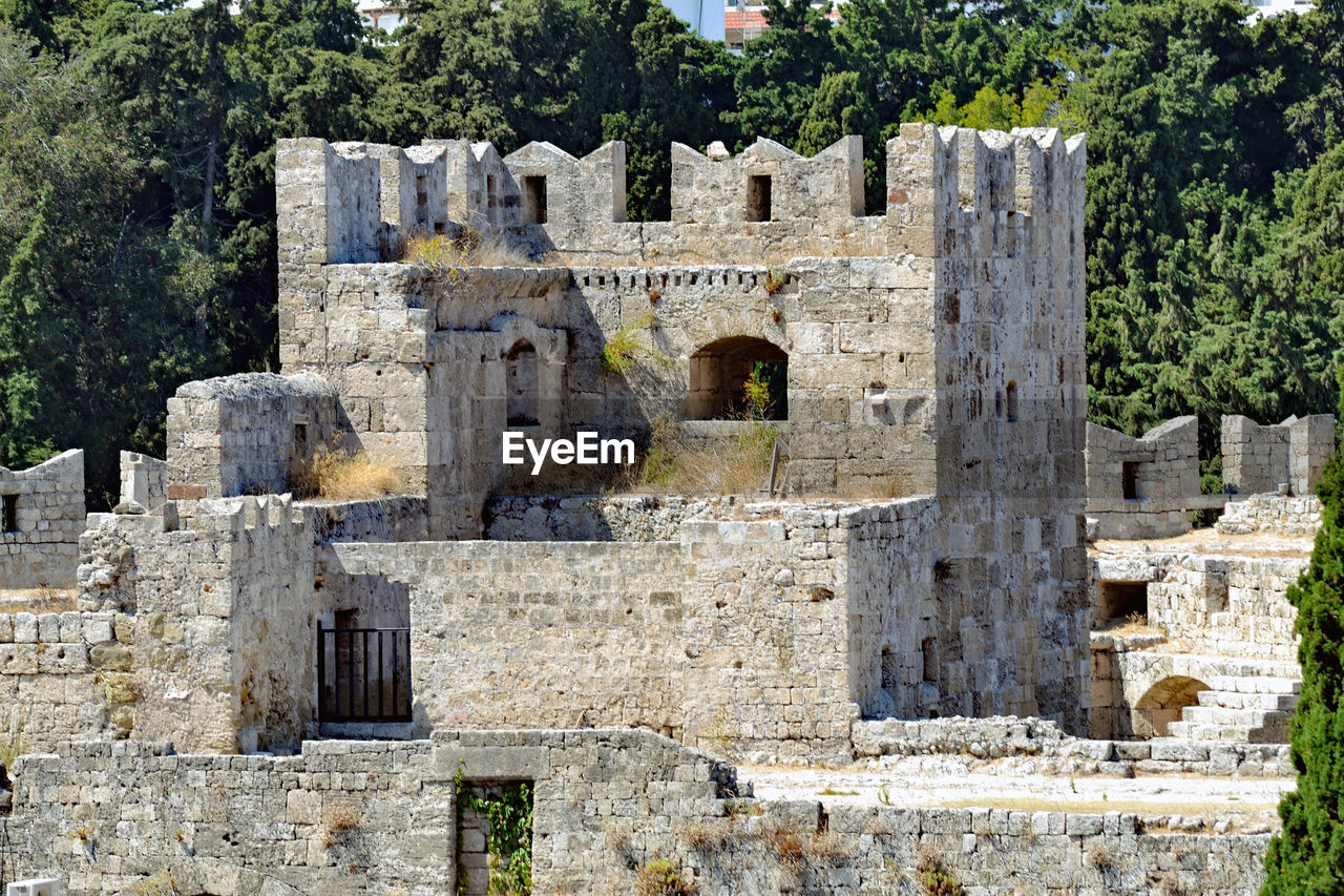 OLD RUIN BUILDING AGAINST TREES