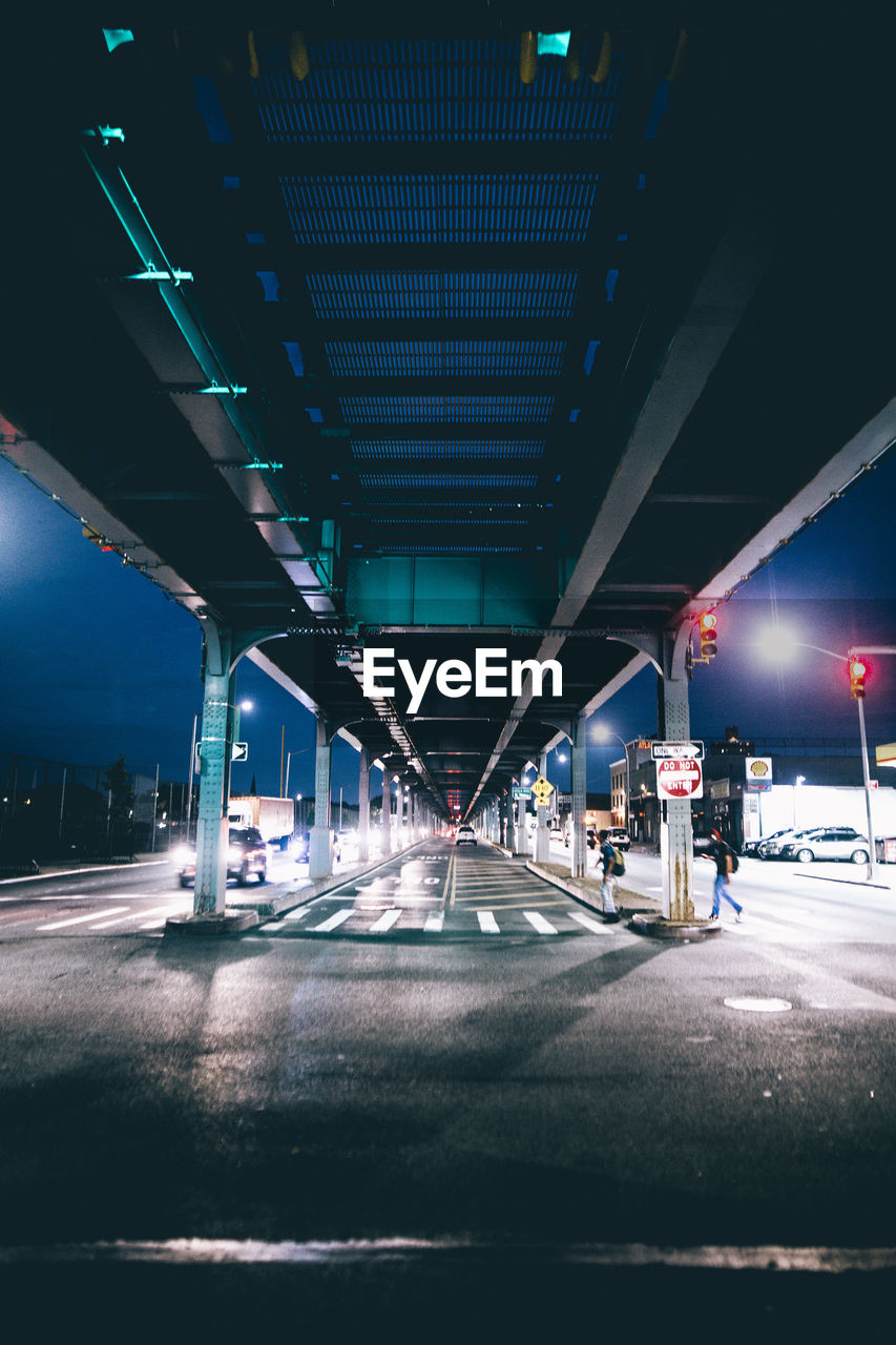 ILLUMINATED ROAD AT NIGHT IN CITY