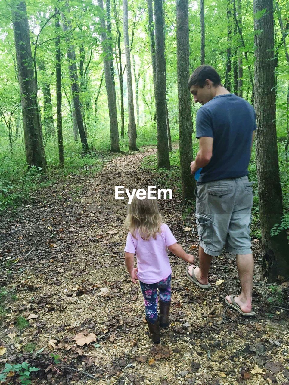 MOTHER AND DAUGHTER IN FOREST