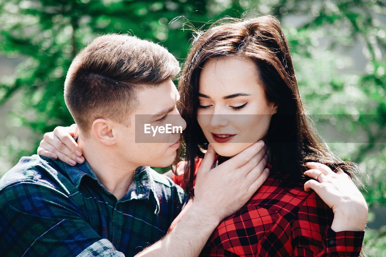 Loving young couple in forest