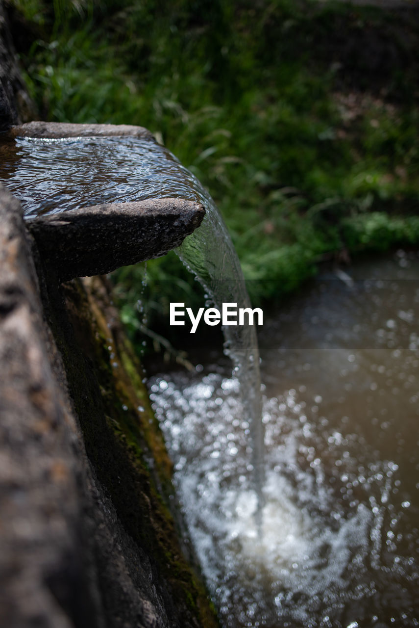 Close-up of water flowing on rock