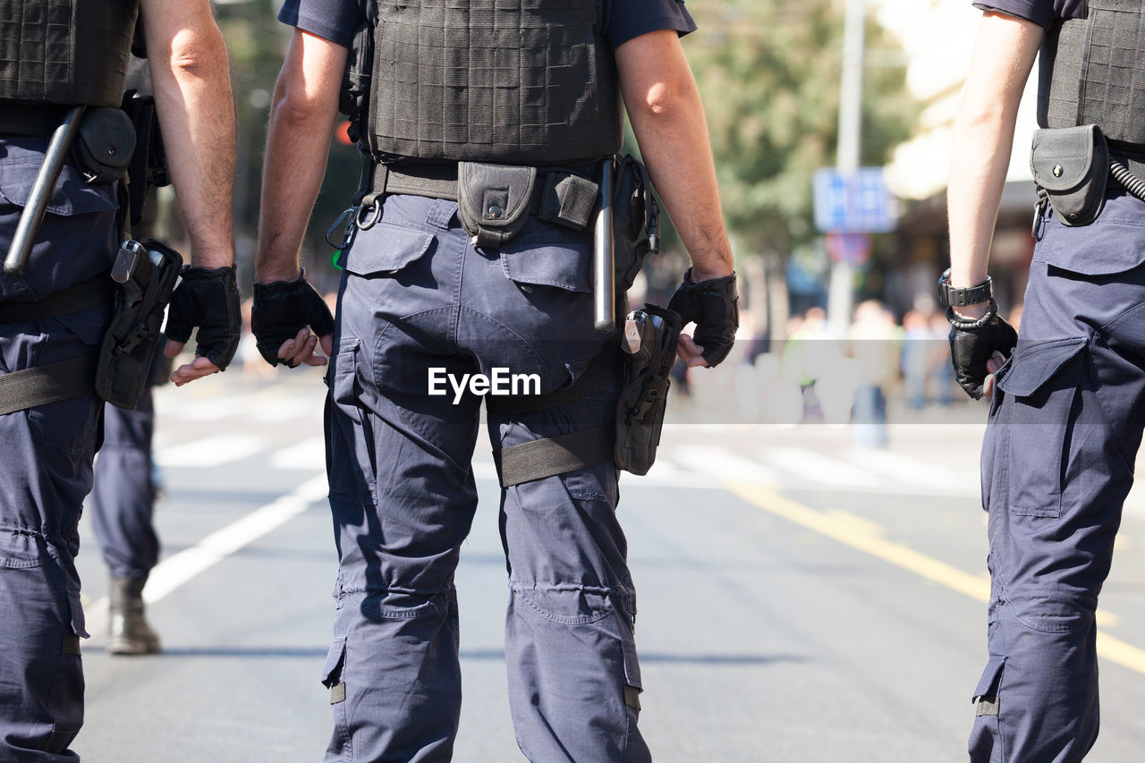 Police force standing on street 