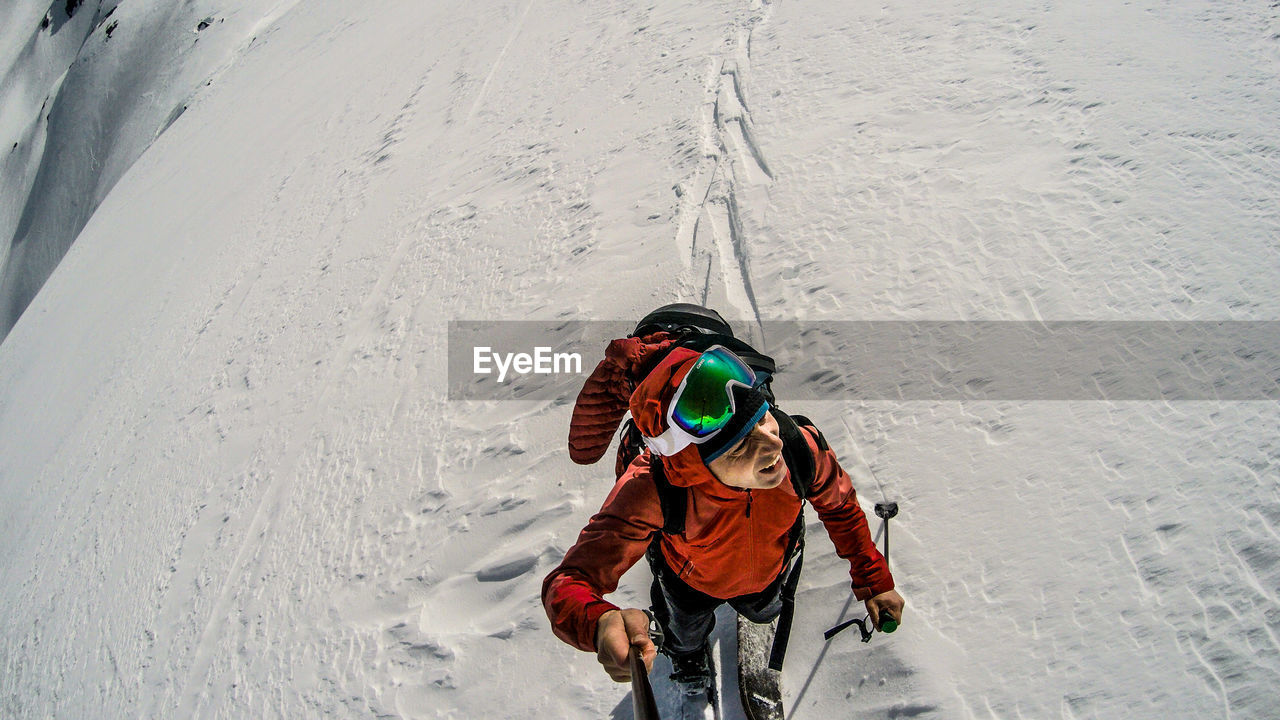 High angle view of man on snow covered land