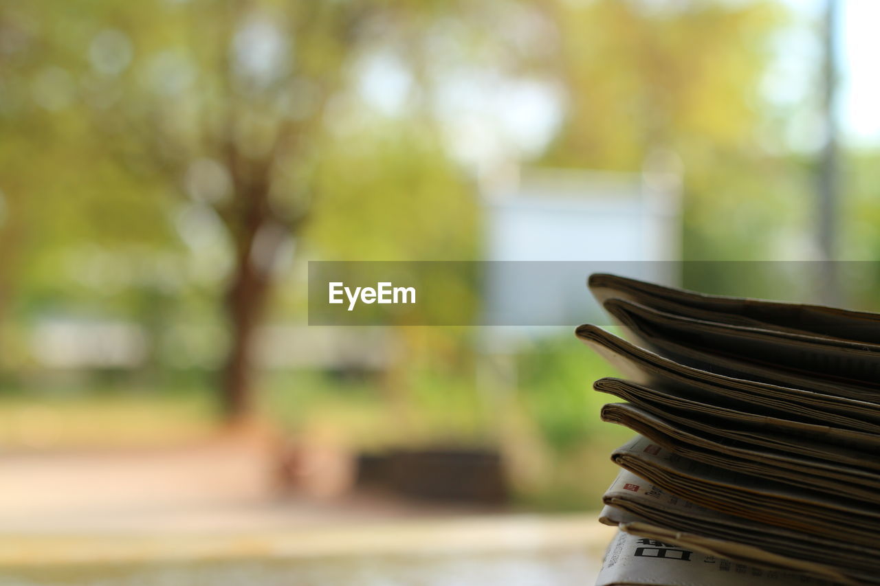 CLOSE-UP OF BOOK ON TABLE