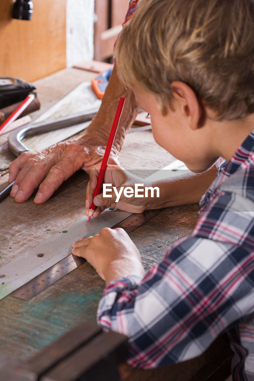 Boy working on table