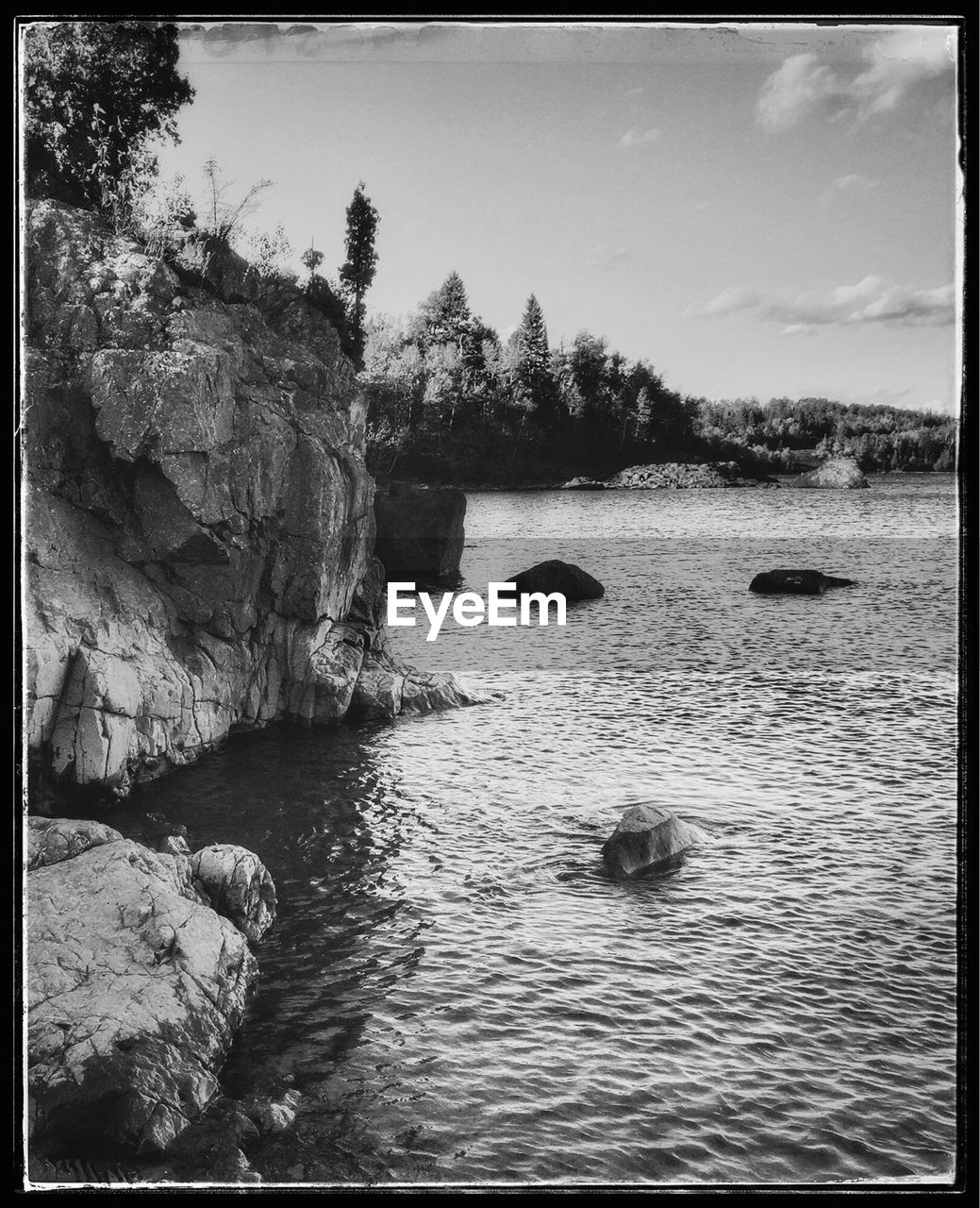 ROCKS AND TREES AGAINST SKY