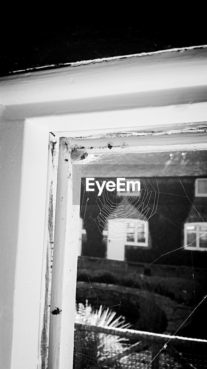 CLOSE-UP OF WET WINDOW AGAINST SKY