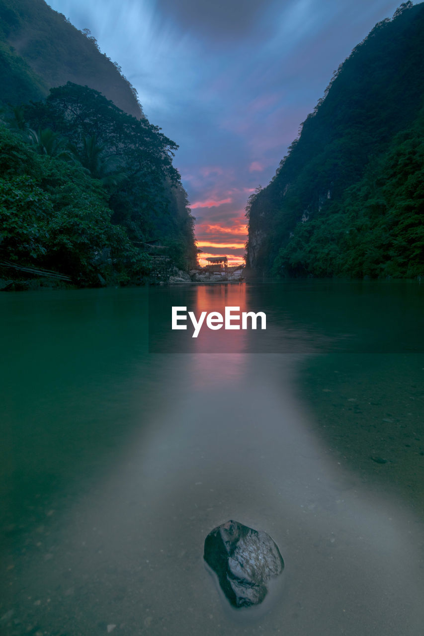 Scenic view of lake against sky during sunset