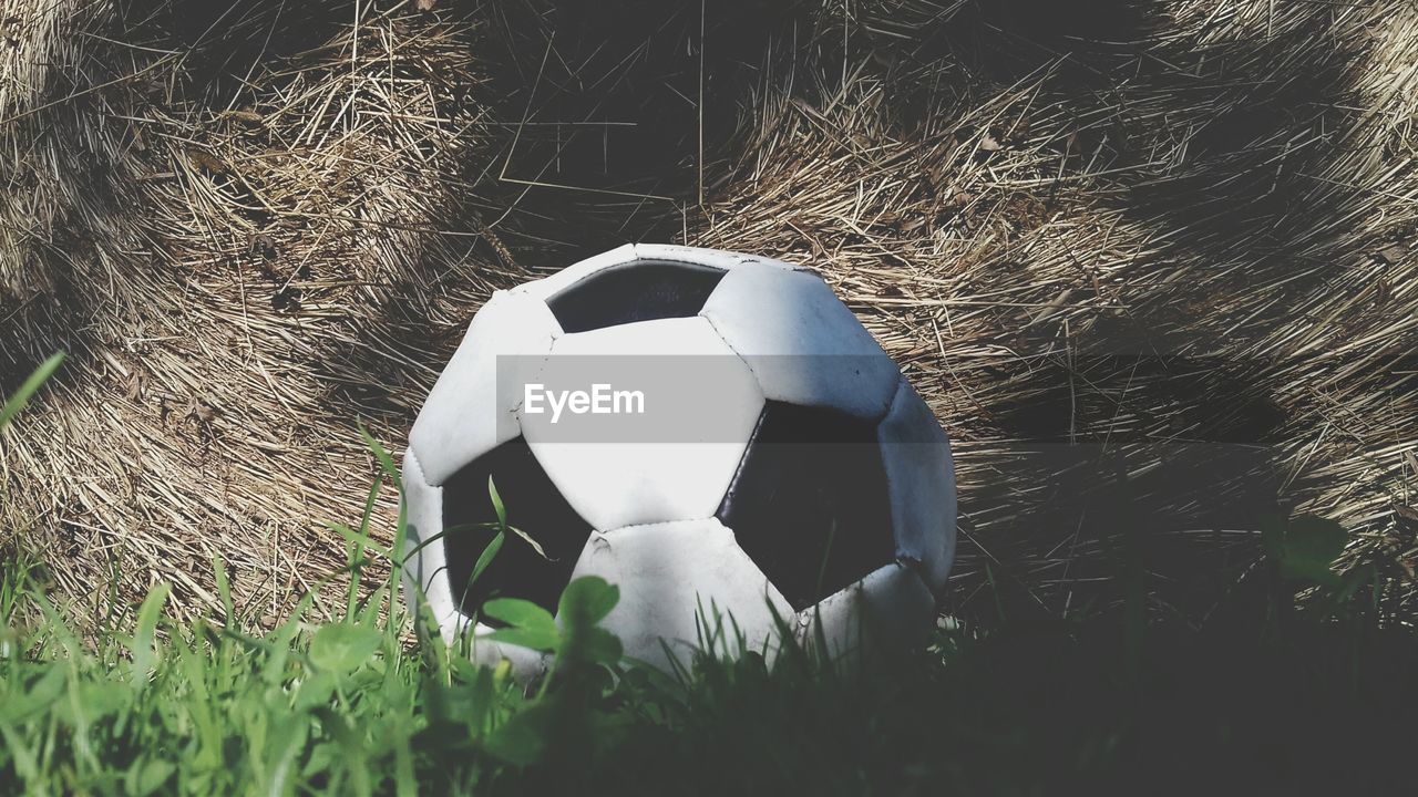 Close-up of soccer ball on field