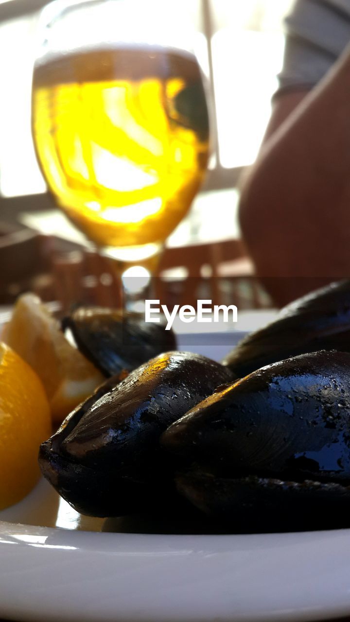 Plate of mussels and glass of white wine