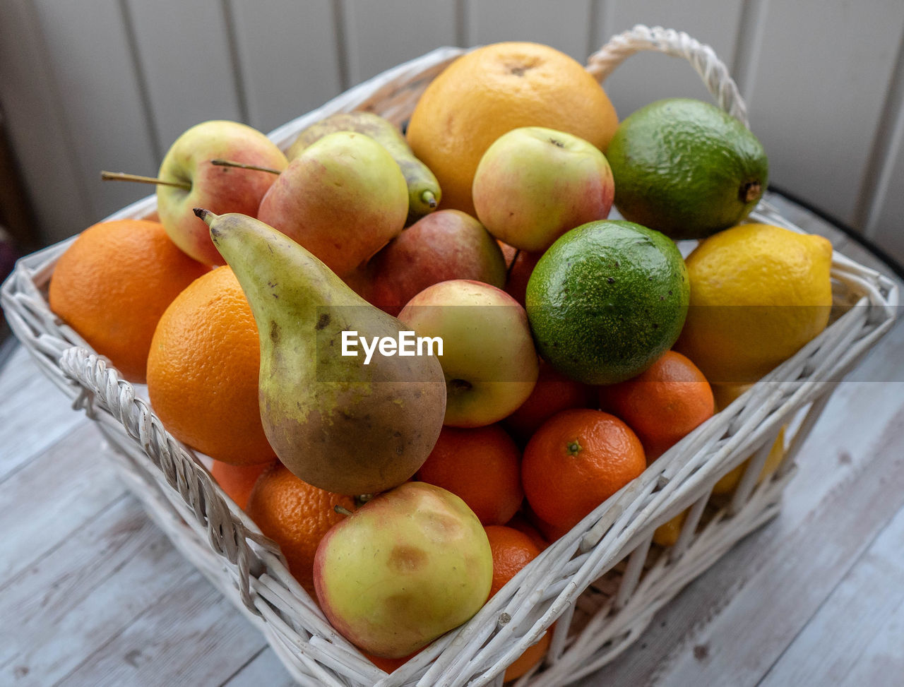 High angle view of fruits in basket on table