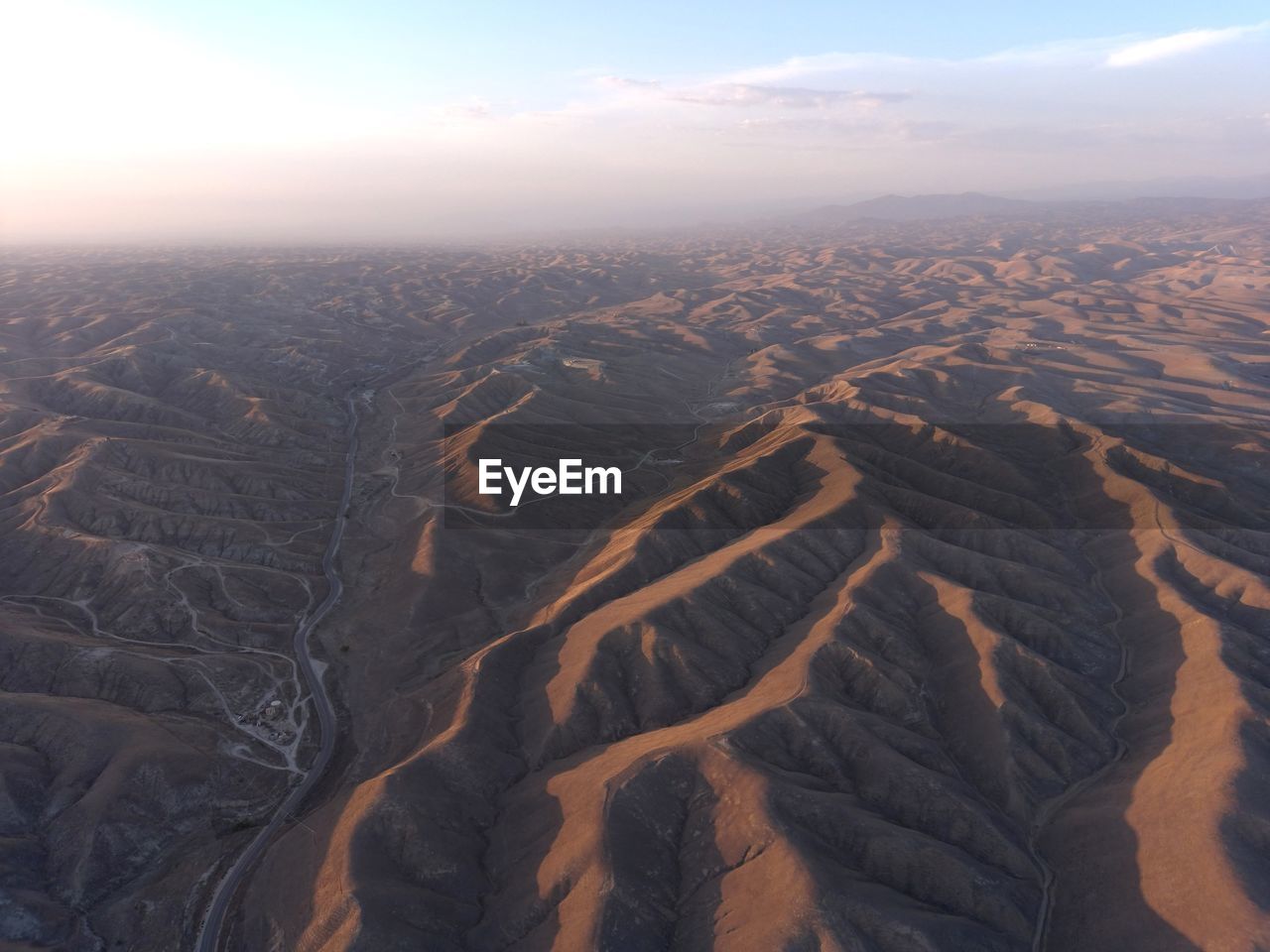 AERIAL VIEW OF DRAMATIC LANDSCAPE DURING SUNSET