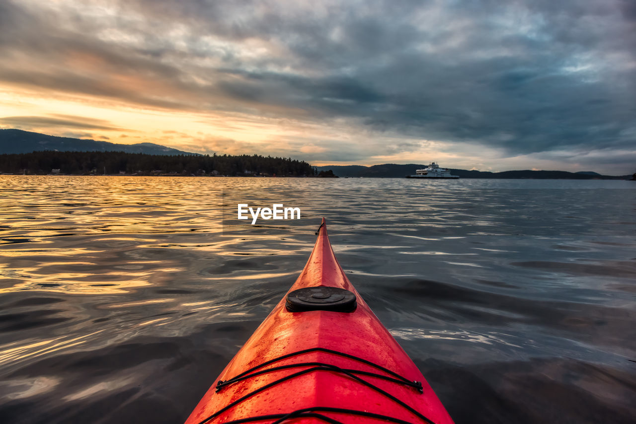 VIEW OF LAKE AGAINST SKY DURING SUNSET