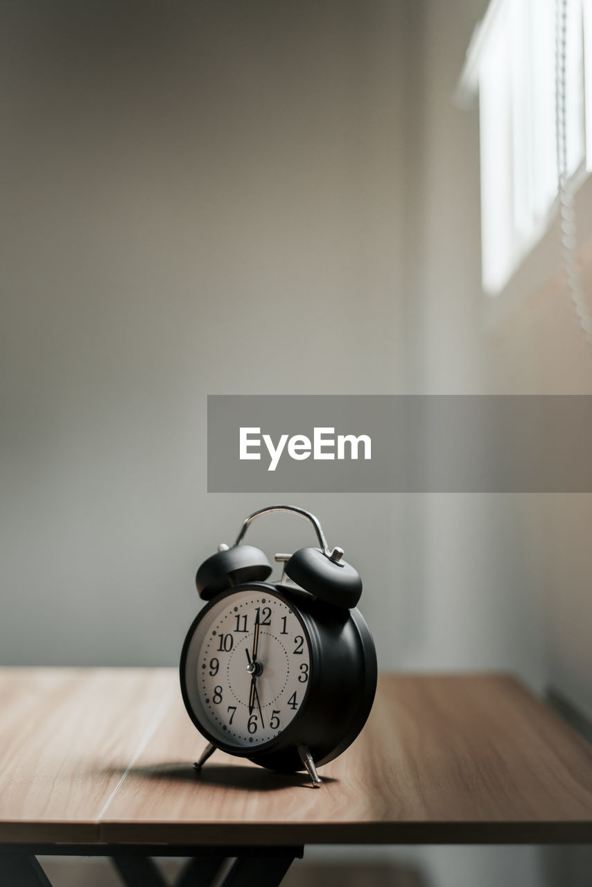close-up of alarm clock on table