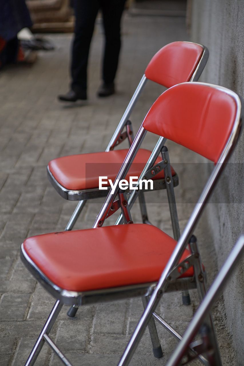 High angle view of empty chairs on street