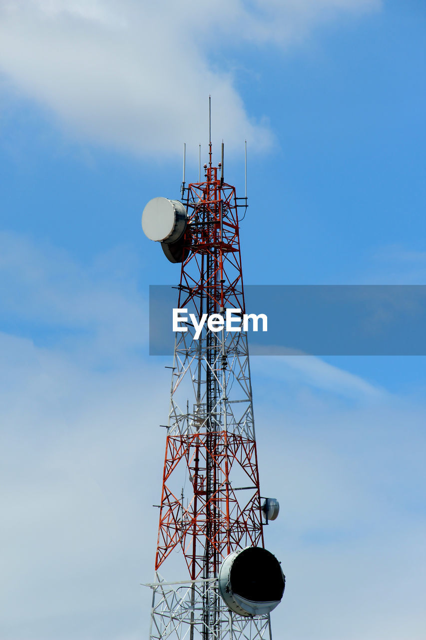 Low angle view of communications tower against sky