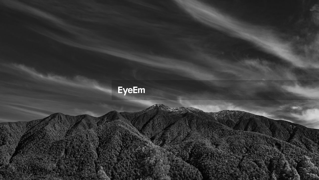 black and white, cloud, sky, environment, nature, landscape, mountain, monochrome, monochrome photography, scenics - nature, darkness, beauty in nature, horizon, no people, land, mountain range, dramatic sky, rock, non-urban scene, tranquility, outdoors, black, tranquil scene