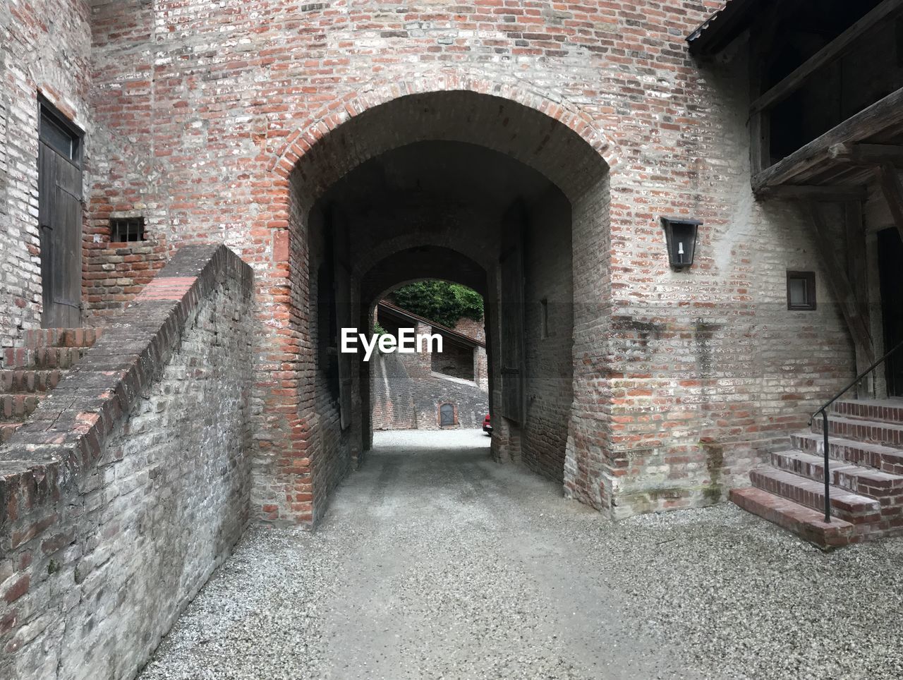 EMPTY CORRIDOR ALONG BUILDINGS