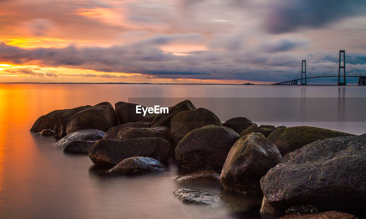 Scenic view of sea against dramatic sky