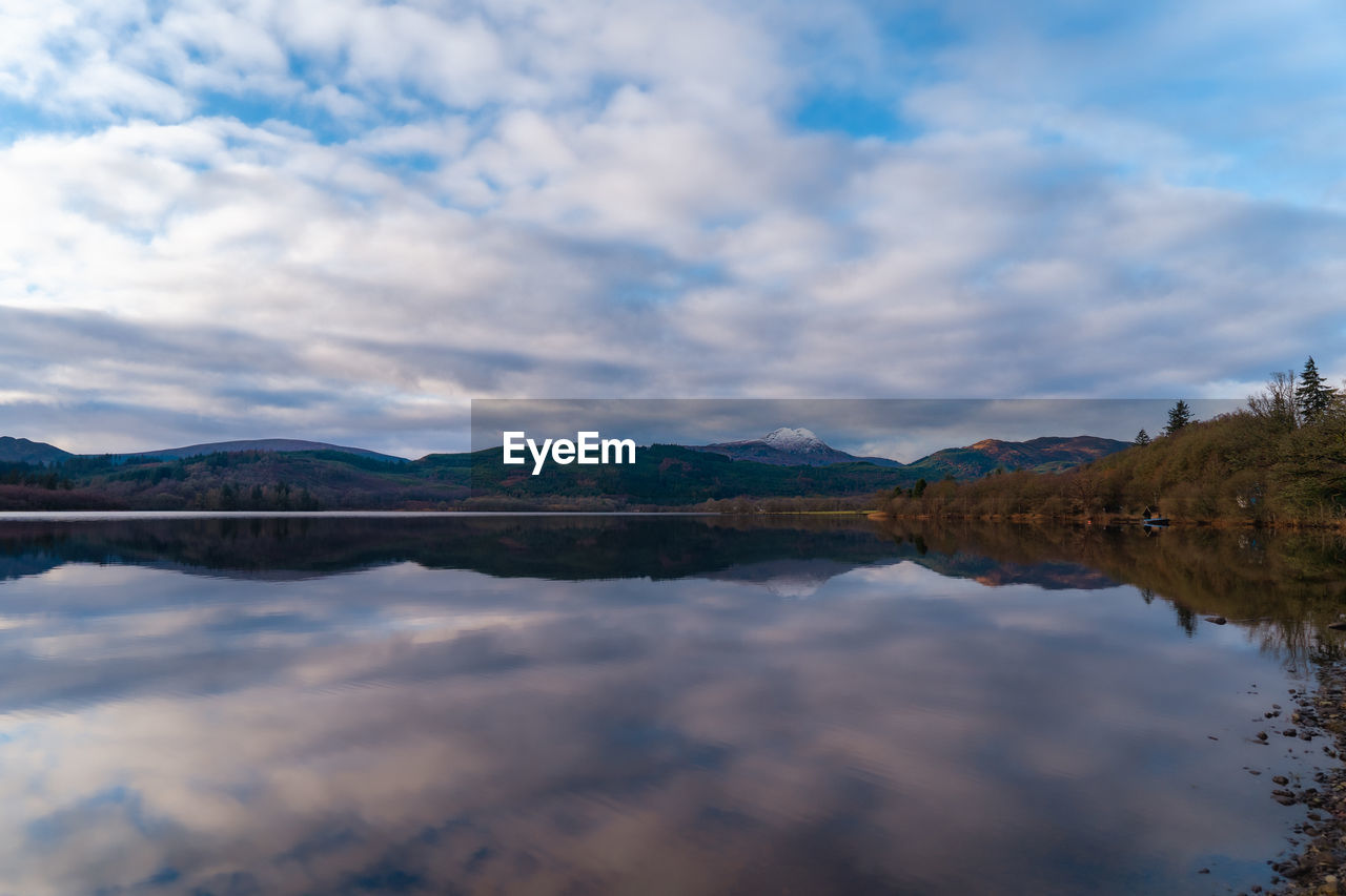 scenic view of lake against sky during sunset