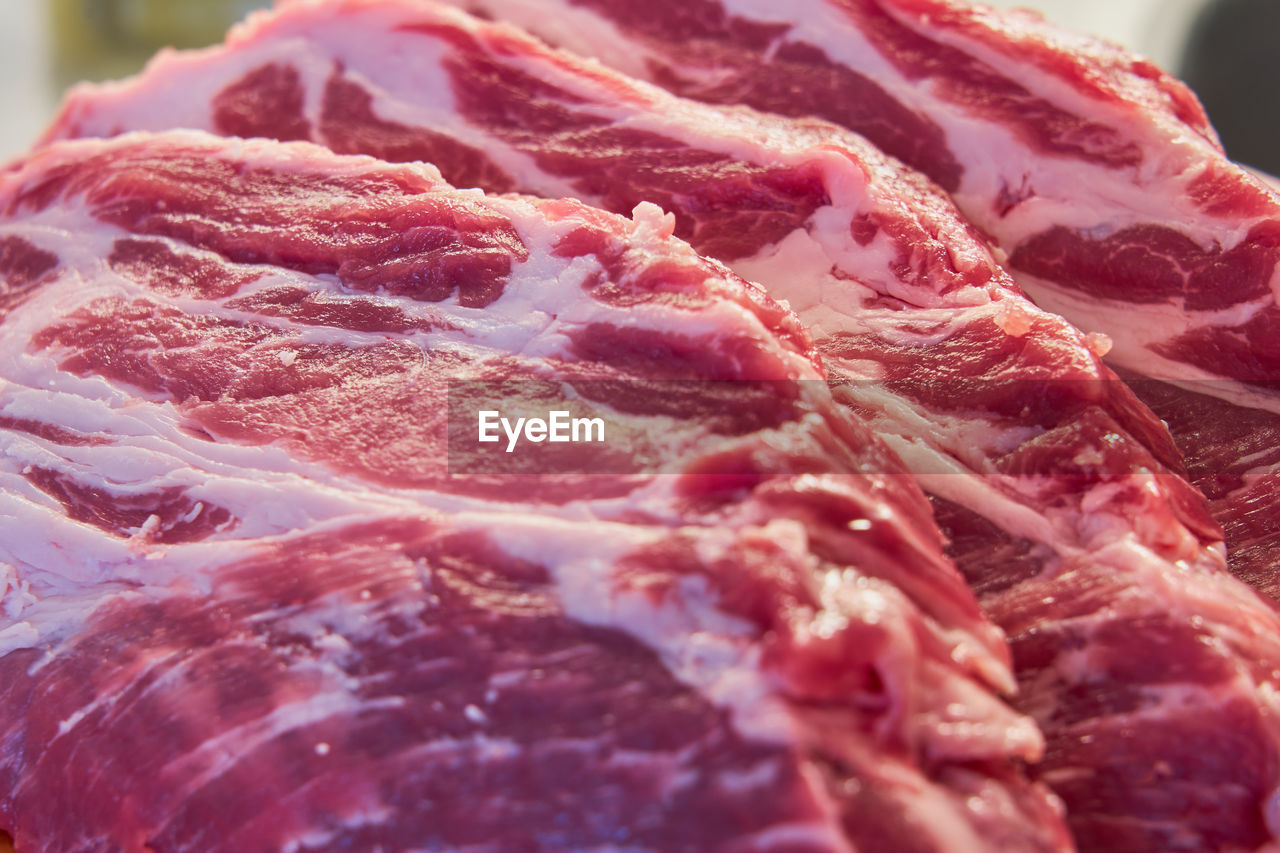 The structure of red pork steaks close-up.