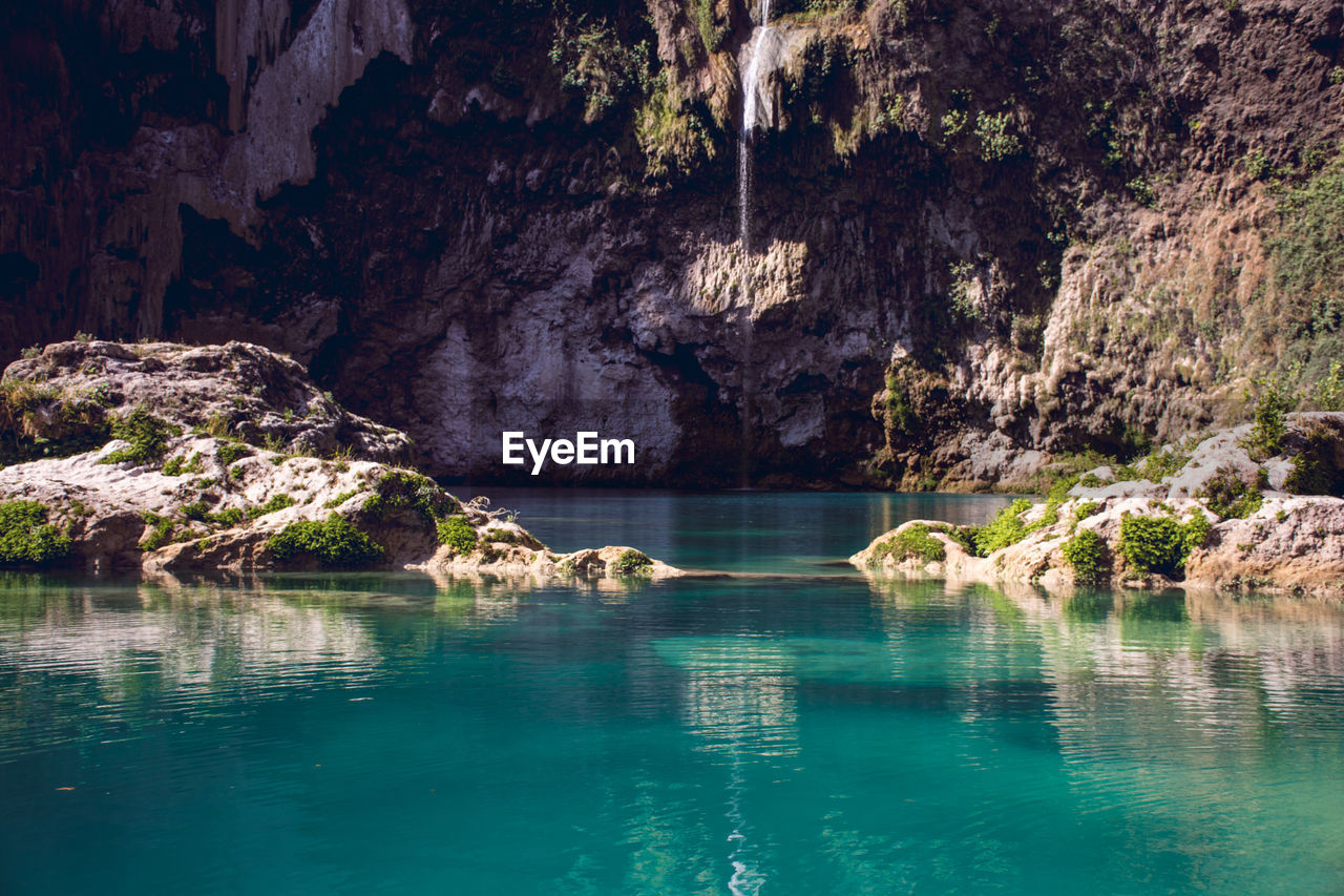 Scenic view of rock formation in water