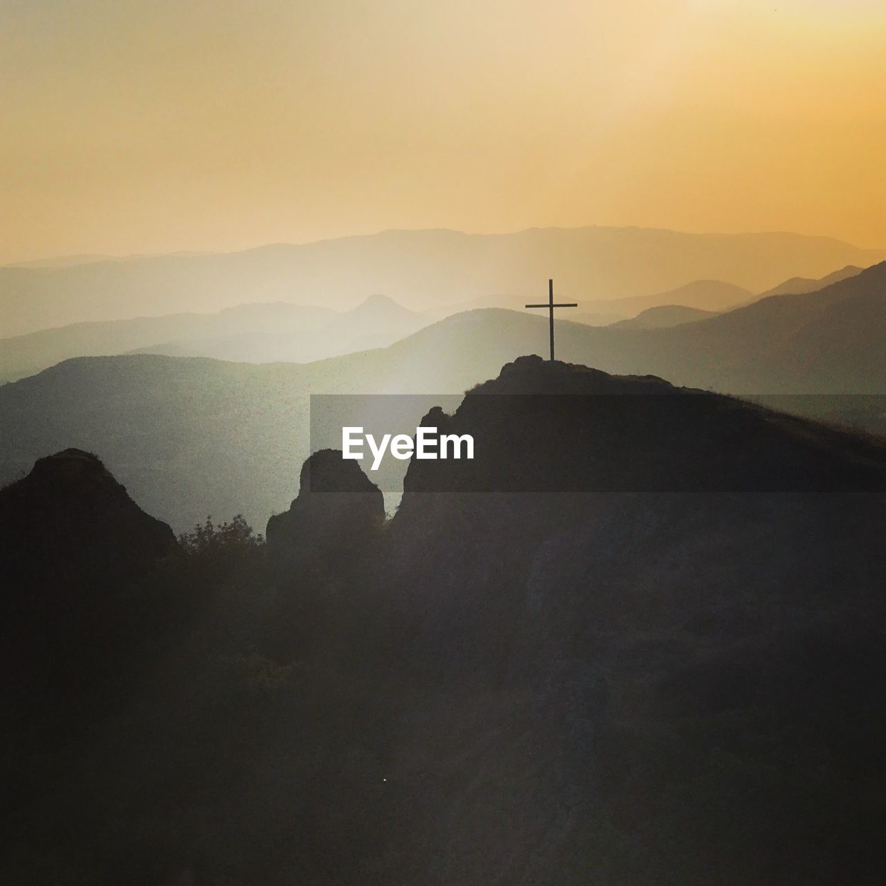 Scenic view of silhouette mountains against sky during sunset