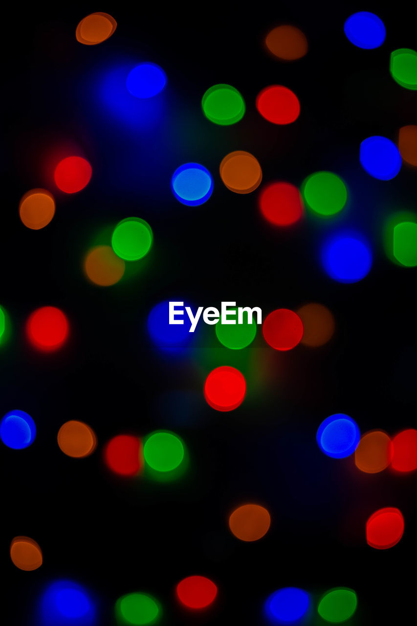 Defocused image of illuminated lights at night