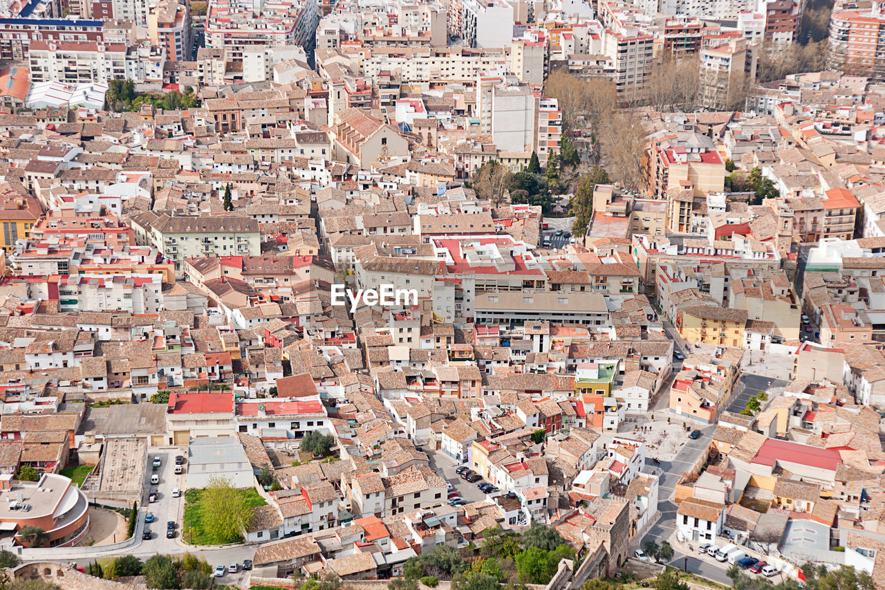 HIGH ANGLE VIEW OF HOUSES IN CITY