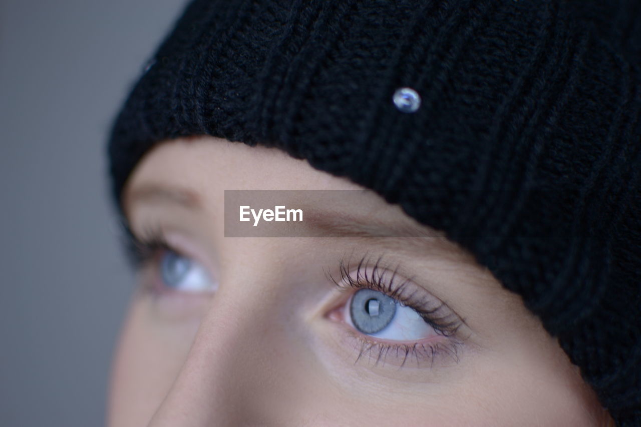 Close-up of young woman with gray eyes