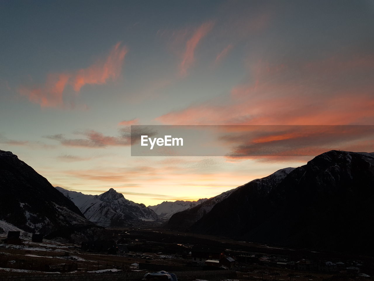 Scenic view of mountains against sky during sunset