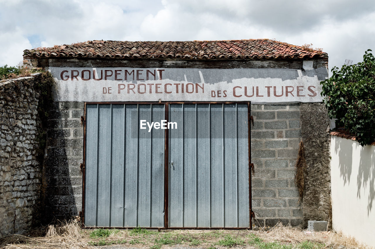 Text on closed door of old building