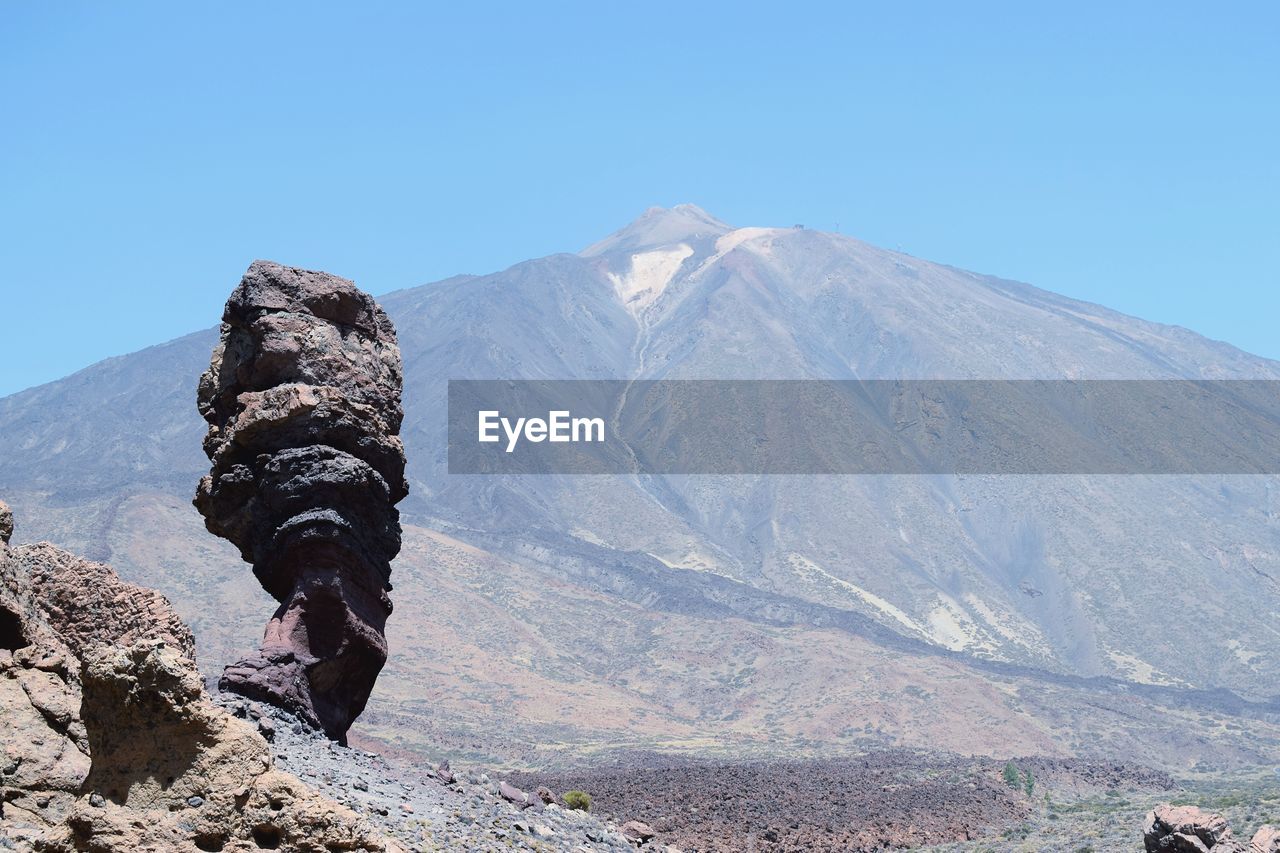 Scenic view of volcanoagainst clear sky