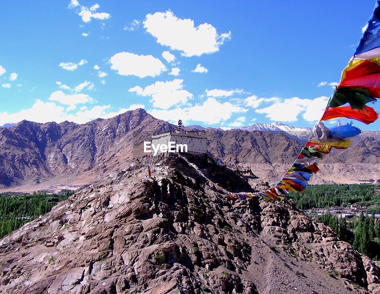 Buddhist prayer flags on himalayas against sky