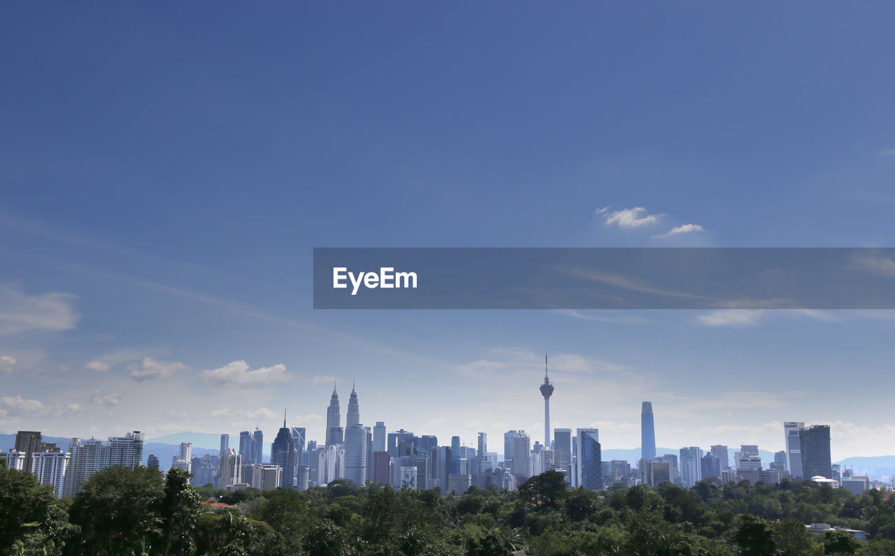 MODERN BUILDINGS IN CITY AGAINST SKY