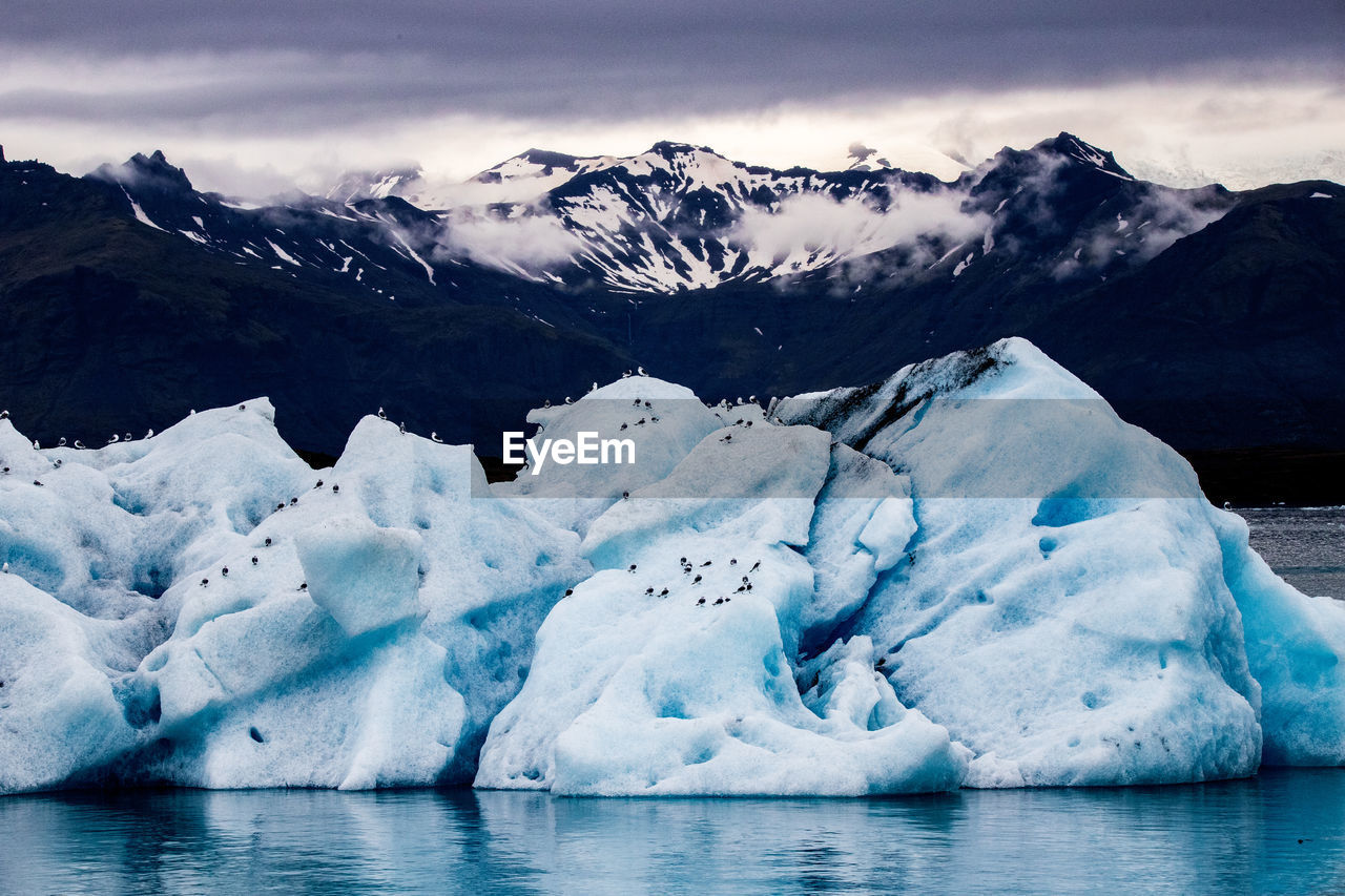 scenic view of snow covered mountains against sky