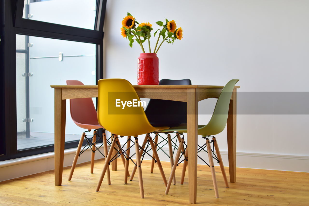 Table and chairs on hardwood floor at home