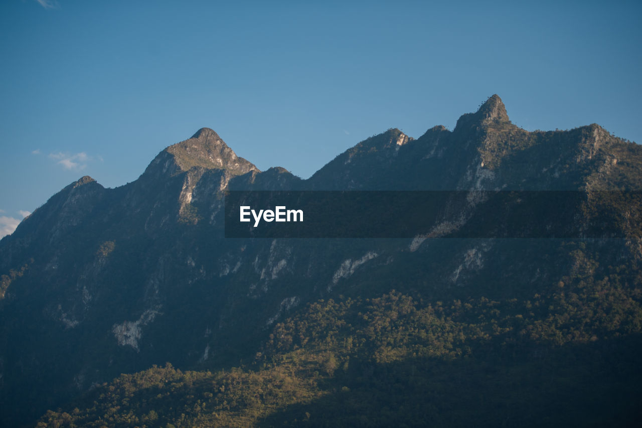 Scenic view of mountains against clear sky