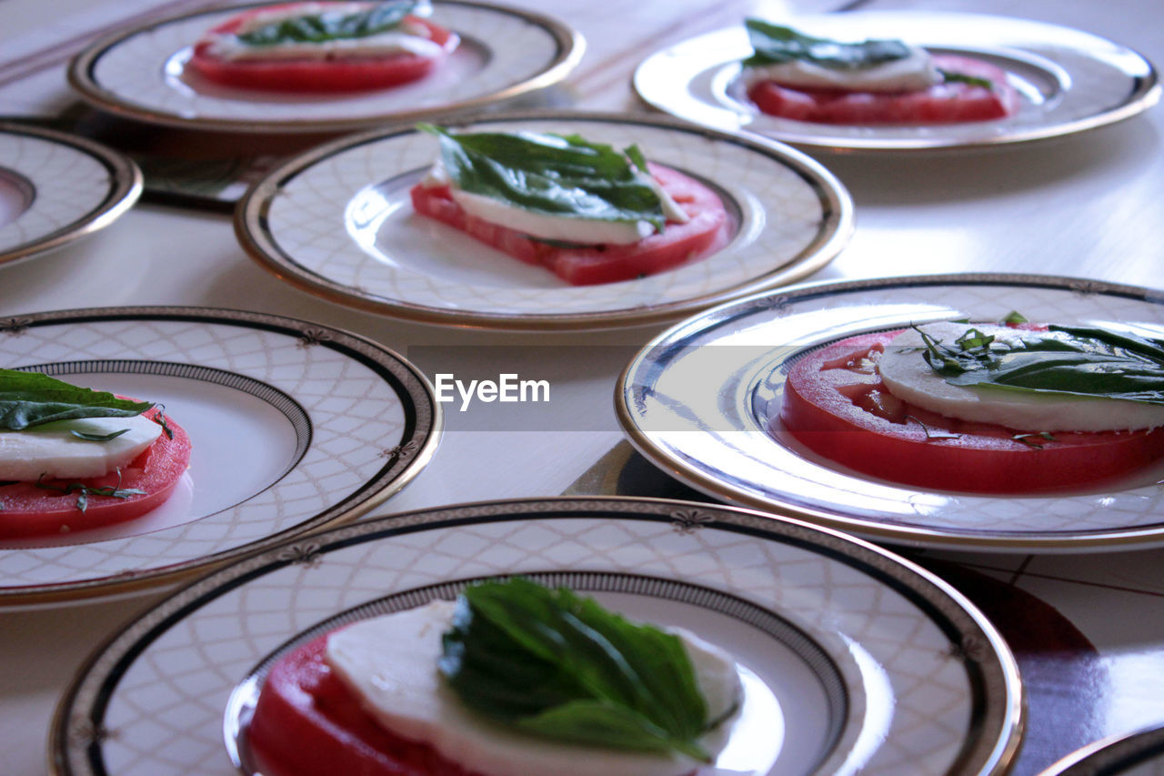 High angle view of caprese salad served in plates