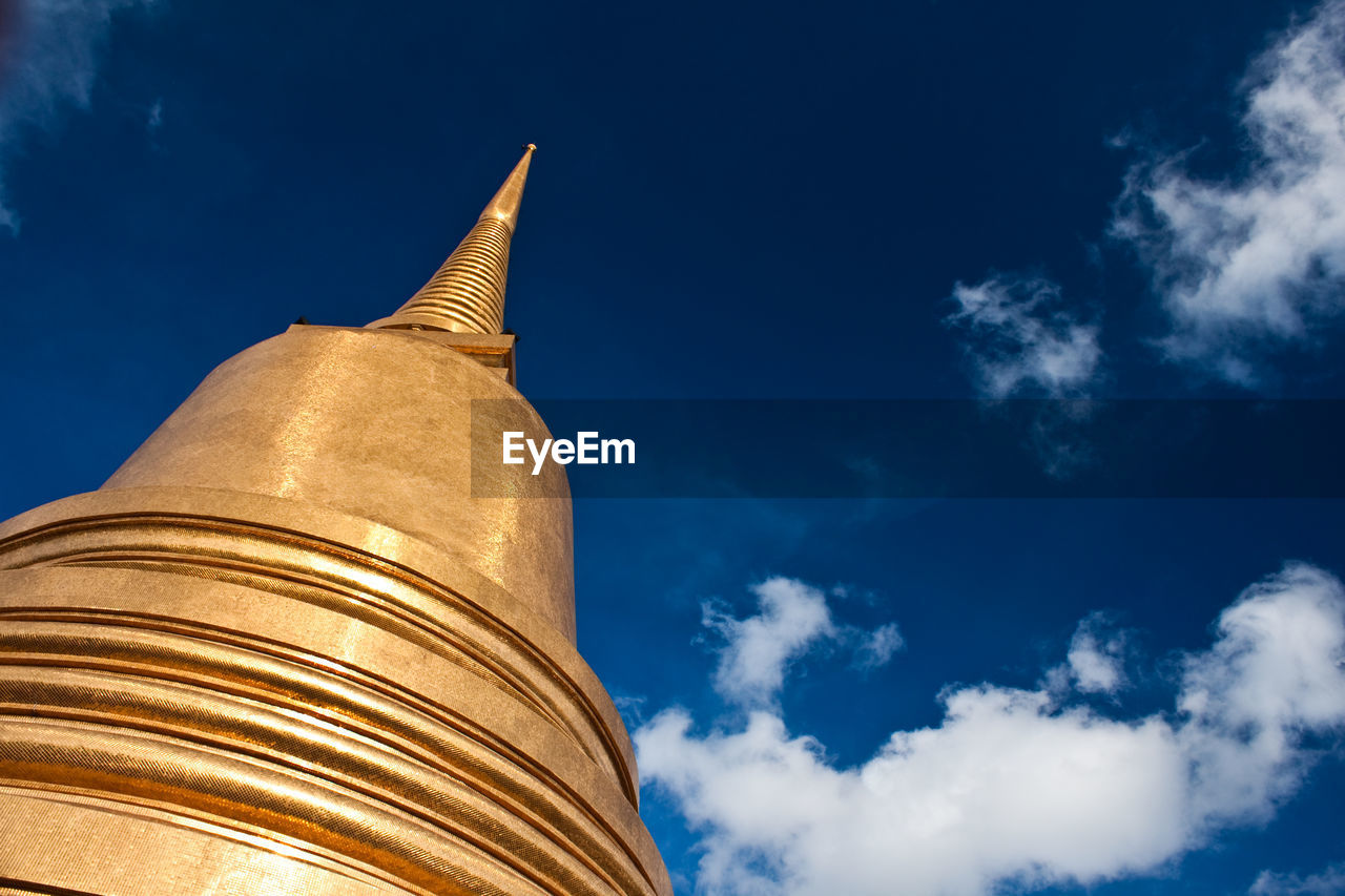 Low angle view of stupa against sky