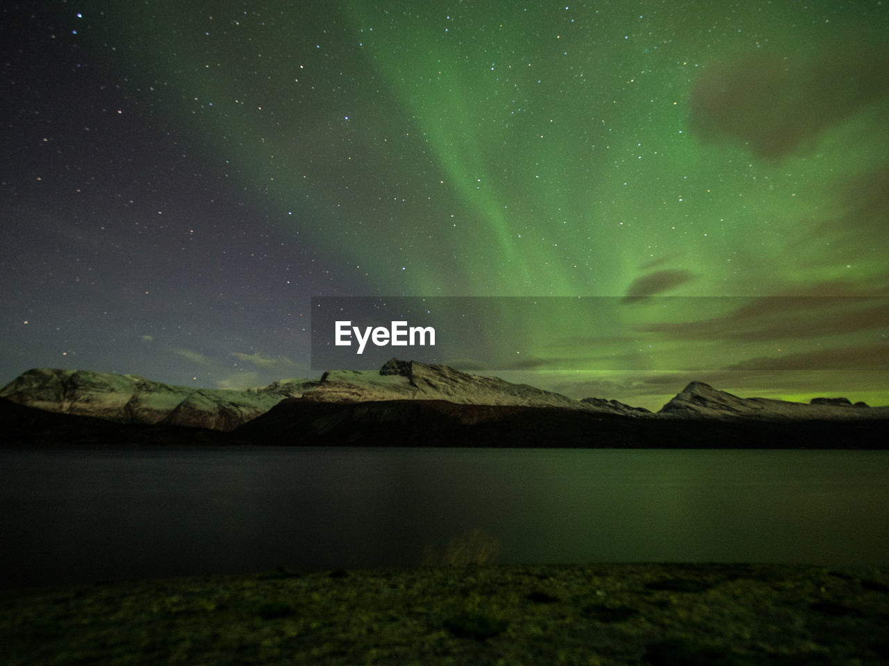 Scenic view of landscape against sky at night