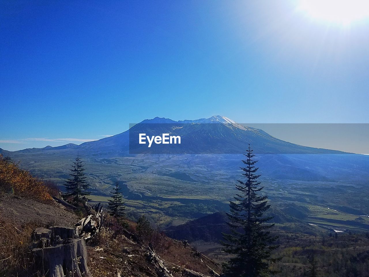 Scenic view of mountains against clear blue sky