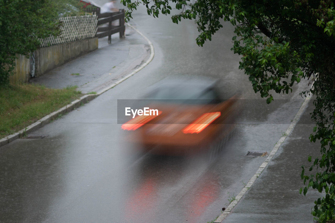 BLURRED MOTION OF CAR ON STREET