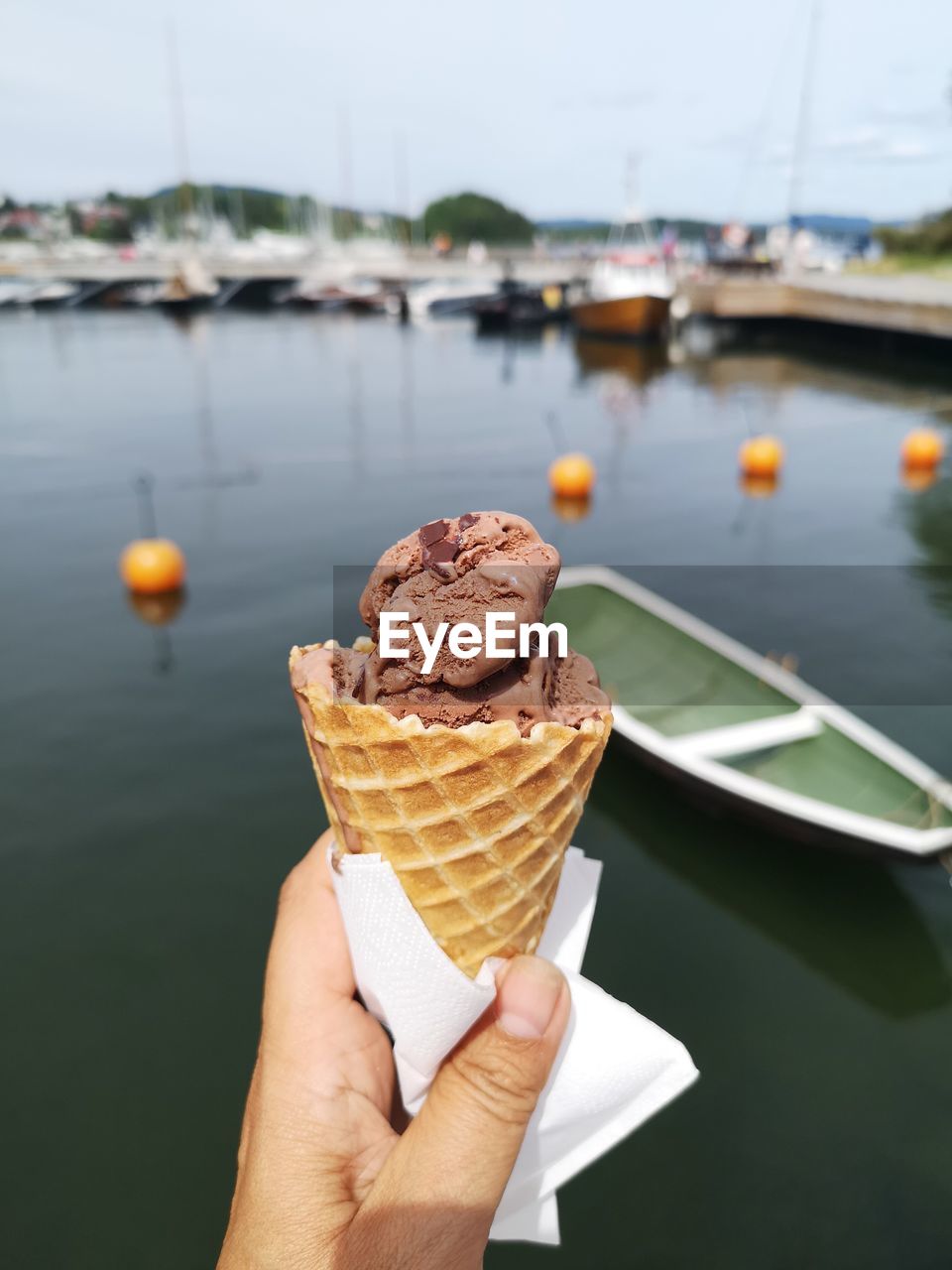 Cropped hand holding ice cream