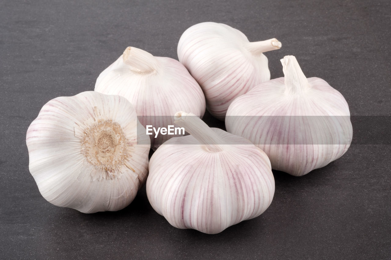 Fresh garlic on stone table