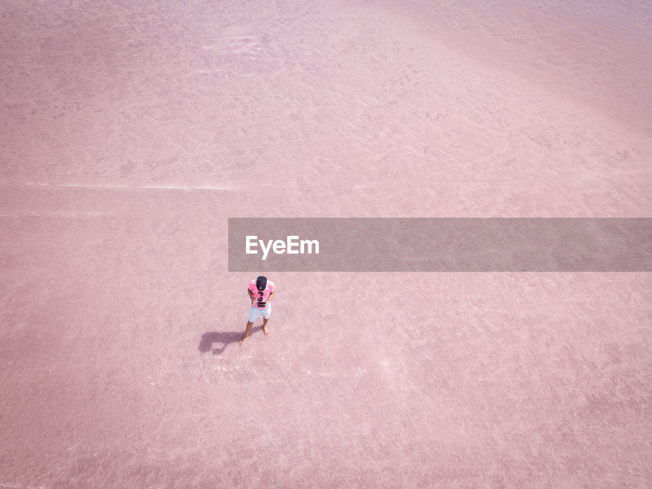 High angle view of man standing on footpath