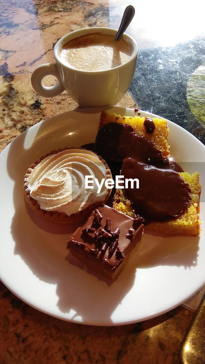 HIGH ANGLE VIEW OF CHOCOLATE CAKE WITH COFFEE