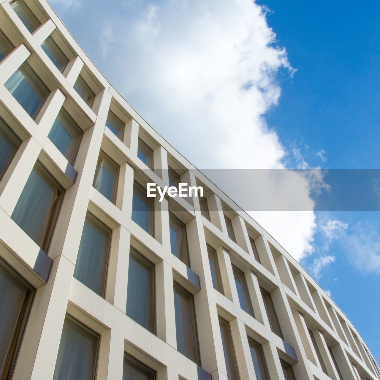 Low angle view of office building against sky