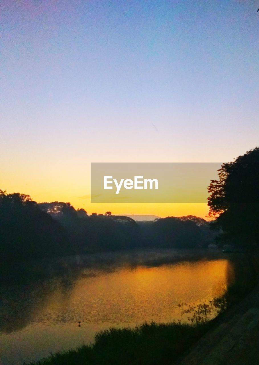 SCENIC VIEW OF LANDSCAPE AGAINST SKY AT SUNSET