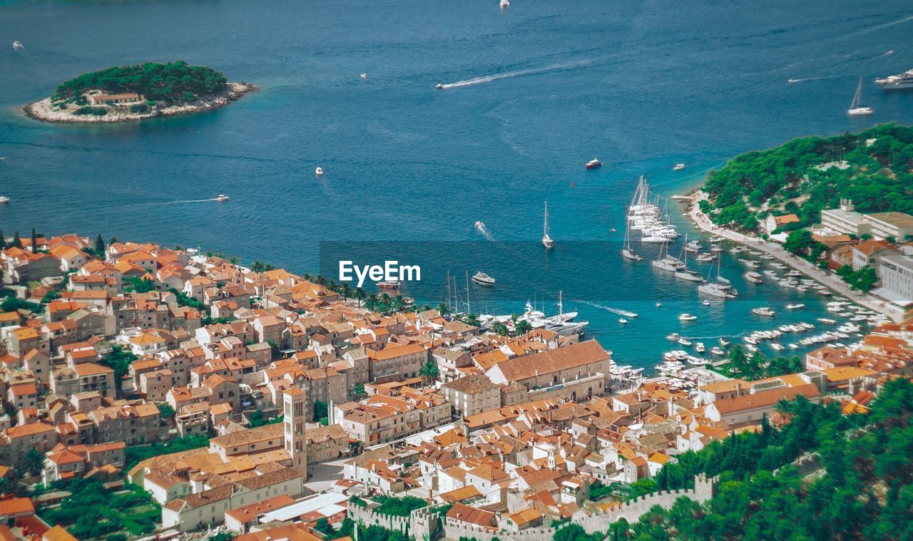 High angle view of townscape by sea